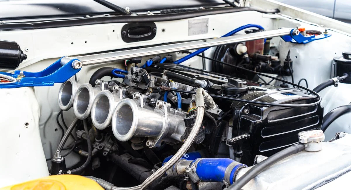 Detailed view of a modified car engine with visible components.